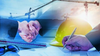 Double exposure of construction site and Business people shaking hands after the contract is signed for construction management Infrastructure plan guidelines concept.
